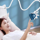 Flexible 360-degree clip phone holder stand mounted on a desk, compatible with iPhone, Samsung, and Xiaomi devices.