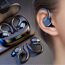 Wireless earbuds with charging case on a textured surface, showing standby time.