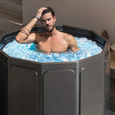 Black collapsible ice bath tub set up outdoors