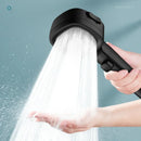 Black handheld showerhead with water flowing, held by a hand against a light blue background