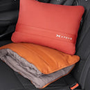 Multifunctional car pillow displayed inside a vehicle, shown unfolded as a blanket and folded as a cushion on a car seat.
