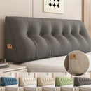 Triangular plush headboard pillow resting against a bed headboard, showcasing soft fabric and wedge shape for ergonomic back support.