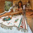 Aztec tribal cotton picnic blanket with tassels, laid out on a grassy outdoor surface—ideal for camping, sofa décor, or cozy indoor use.